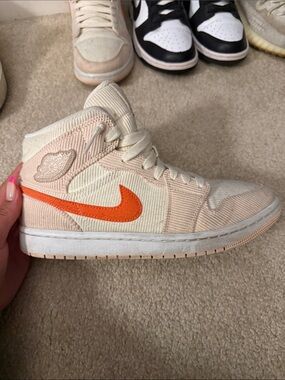 Nike Women’s Mid-Top Sneaker in Cream with Orange Swoosh
